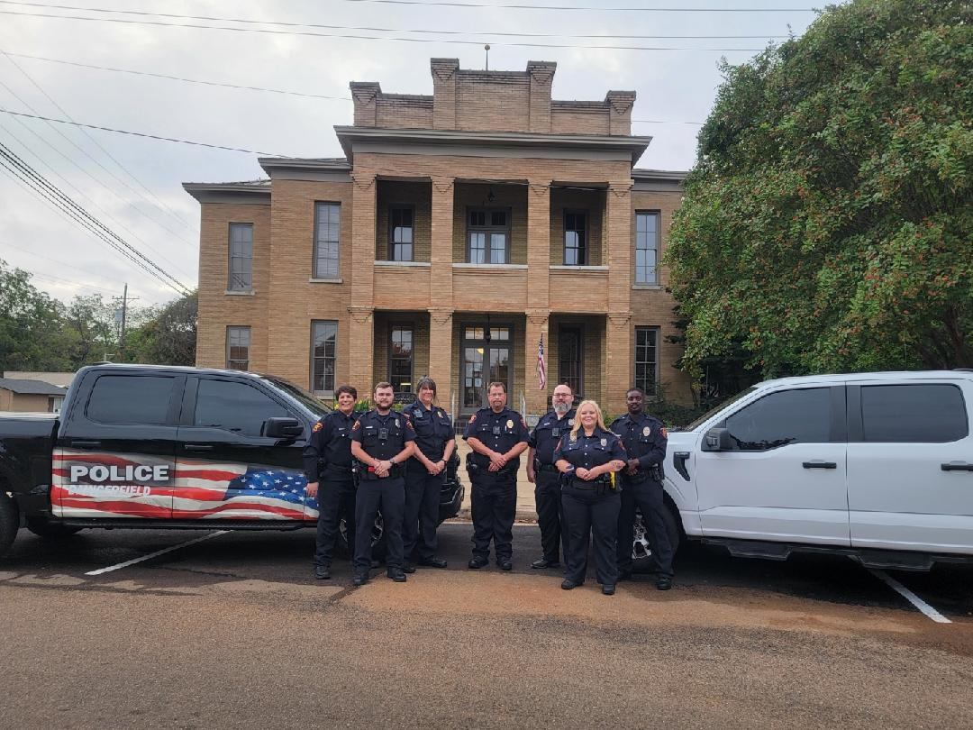 city hall building, trucks and officers